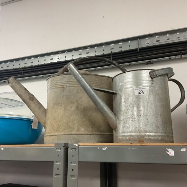 Two vintage galvanised watering cans