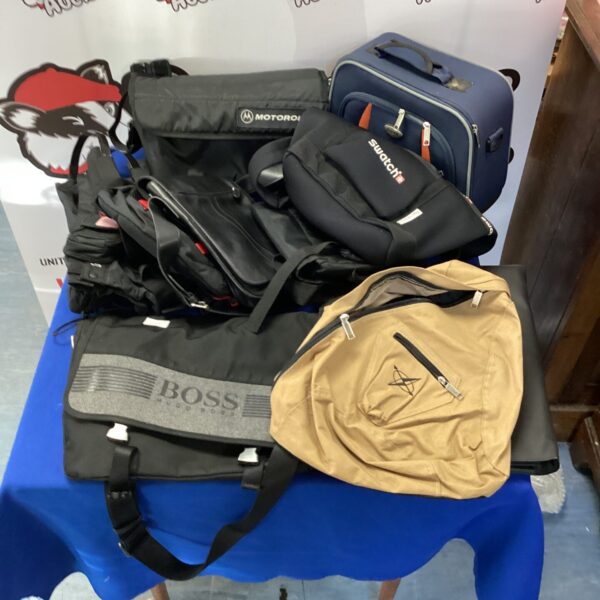 Mixed lot of branded bags including Hugo Boss, Motorola and Swatch.