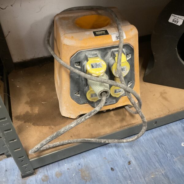 Yellow Defender 100v extension socket box for construction sites.