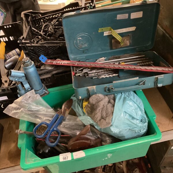 Mixed tool lot in a plastic storage box, including a bottle jack.