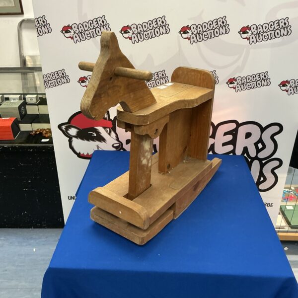 Vintage wooden rocking horse, a classic toy for collectors.