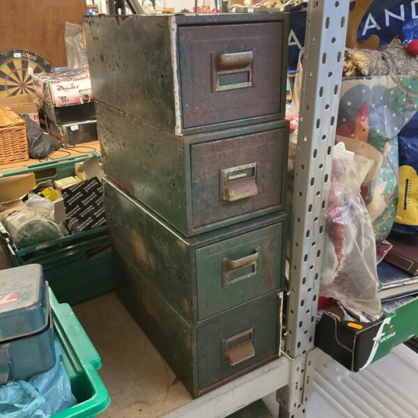 Vintage metal machinist drawers offering industrial storage solutions.