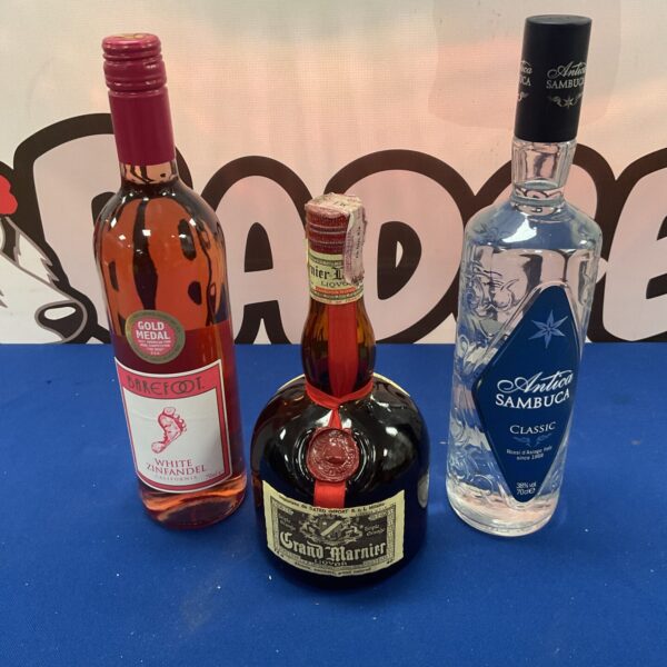 74cl bottle Grand Marnier, 70cl bottle Sambuka and bottle of white Zinfandel wine