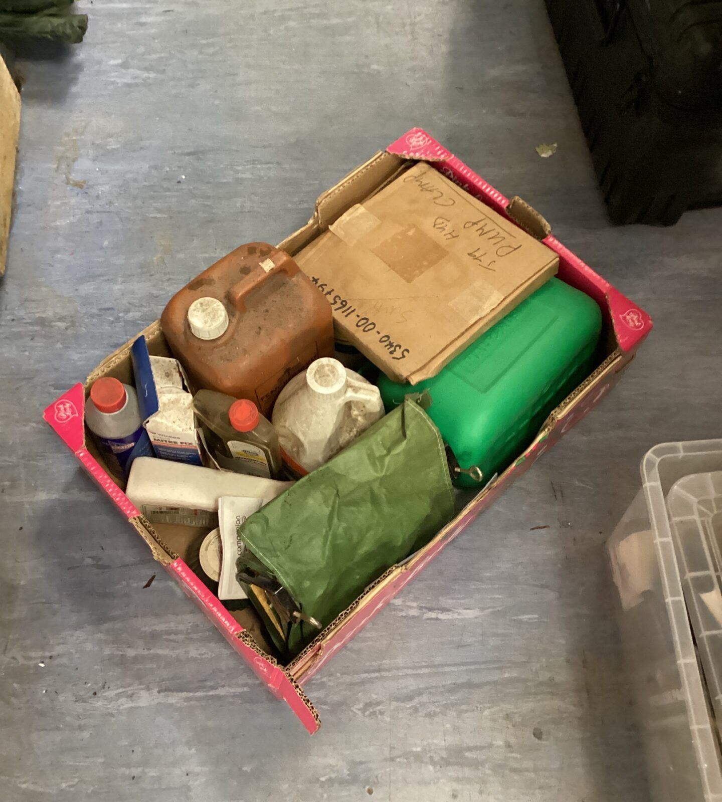 Tray of mixed chemicals with halfords fuel can