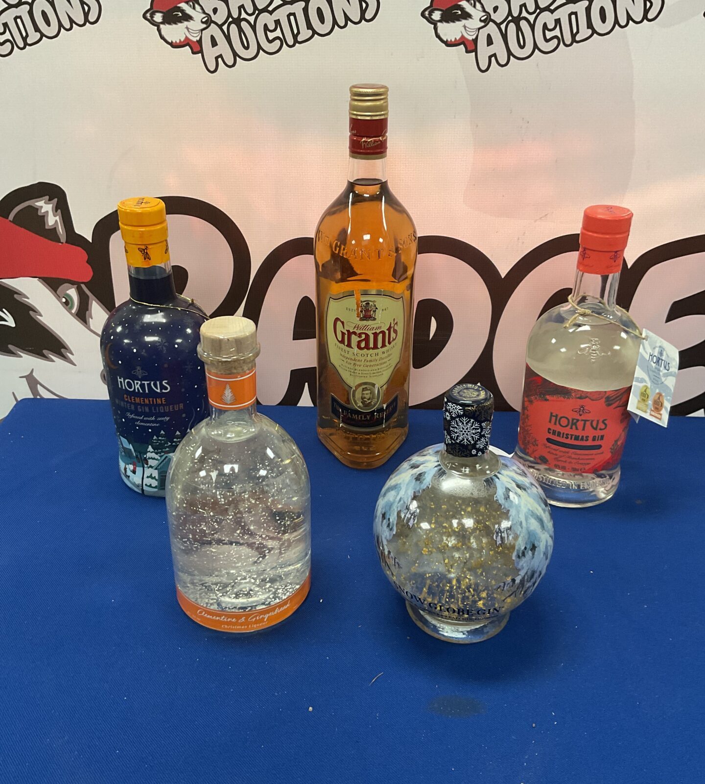 1ltr Bottle Grants whiskey,two b700ml bottles of Hortus gin Bottle of snow globe gin and clementine and gingerbread liqueur