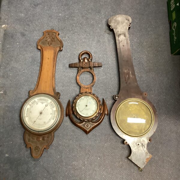 Three antique oak cased barometers