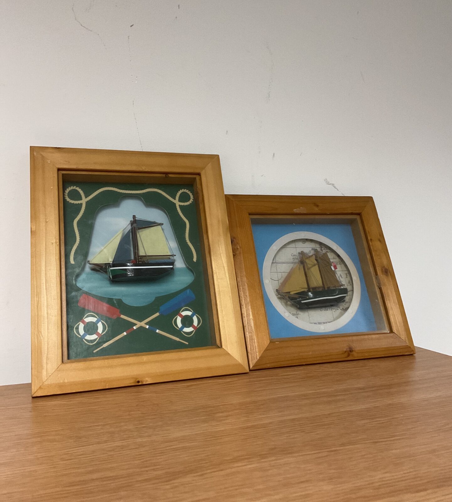 Pair of nautical wooden ship framed dioramas