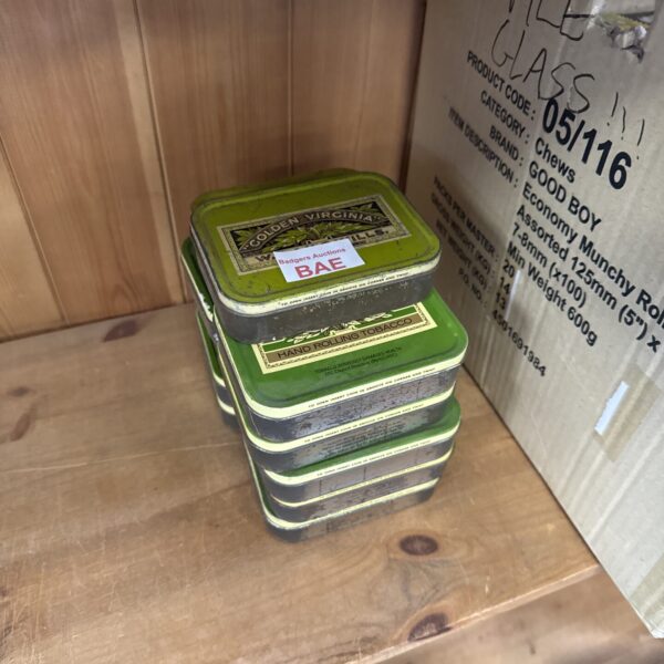 Eleven golden Virginia tobacco tins