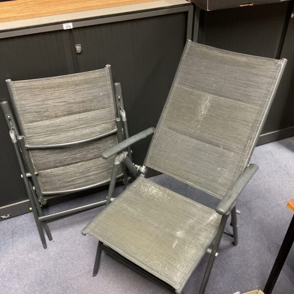 Pair of grey folding garden chairs with woven plastic seats.