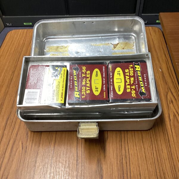 Vintage metal toolbox with 10mm staples inside.