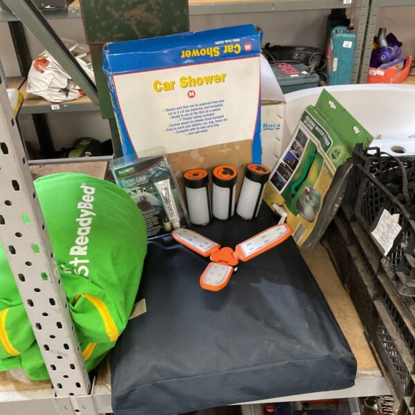 Lot of camping equipment including led lights, car powered shower & folding shelving unit