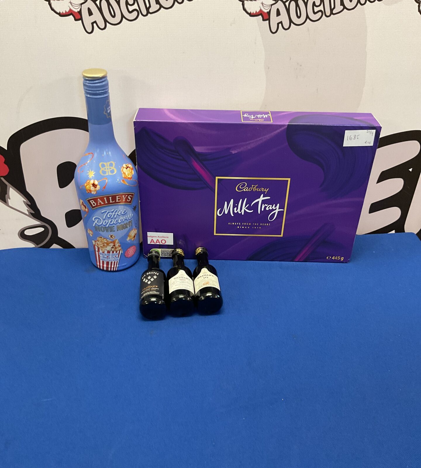 Selection of mixed items inc Sealed Baileys Toffee Popcorn, three bottles of port and new cadbury milk tray new in date
