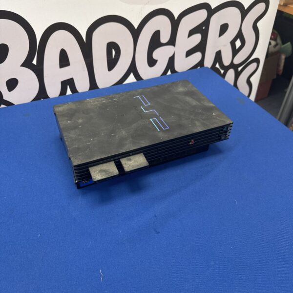 Black Sony PlayStation 2 console for retro gaming.
