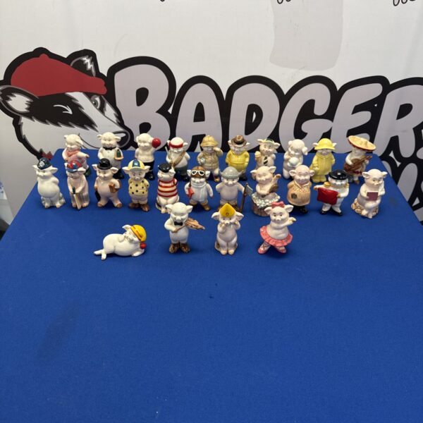 Full set of 25 porcelain pig figurines, a charming collectible.
