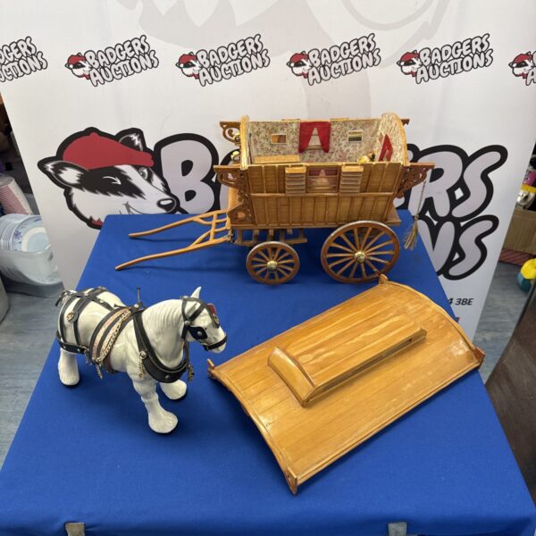 Detailed wooden wagon display with horse and miniature scene.