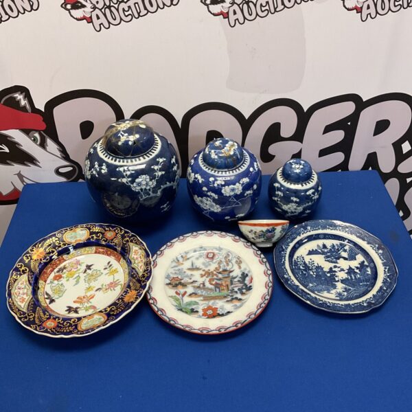 Antique Chinese ginger jars and decorative plates in a collectible lot.