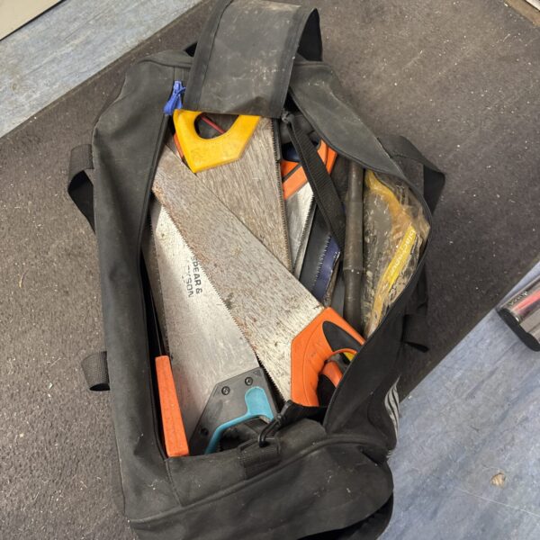 Large adidas hold-all full of tools - mostly saws