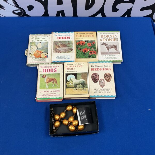 Vintage Observer Books and necklace collection, detailed illustrated guides.