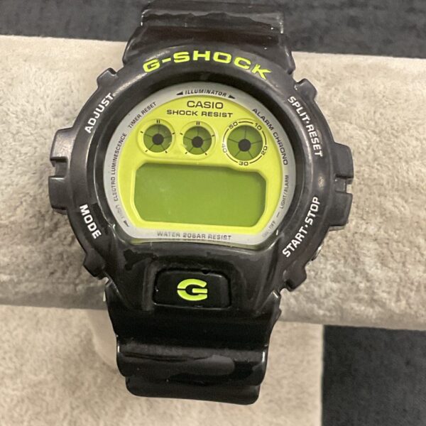 Vintage Casio G Shock digital watch with a black resin strap.