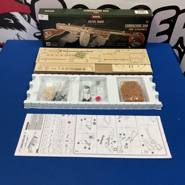 Boxed Rokr Justice Guard wooden submachine gun model.