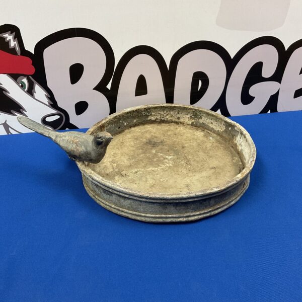 Antique lead bird bath with bird on edge