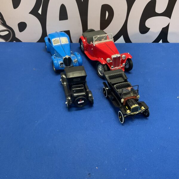 Diecast model cars, a blue and red vintage selection.