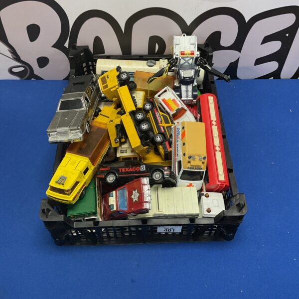 Crate full of vintage Matchbox Superkings diecast toy cars and trucks.