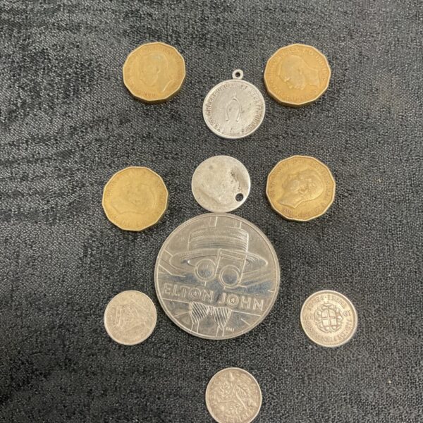 Elton John commemorative coin and assorted British coins collection.