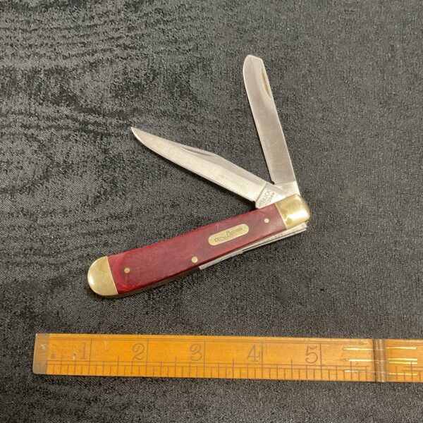 Vintage Buck pocket knife with wooden handle and two blades.