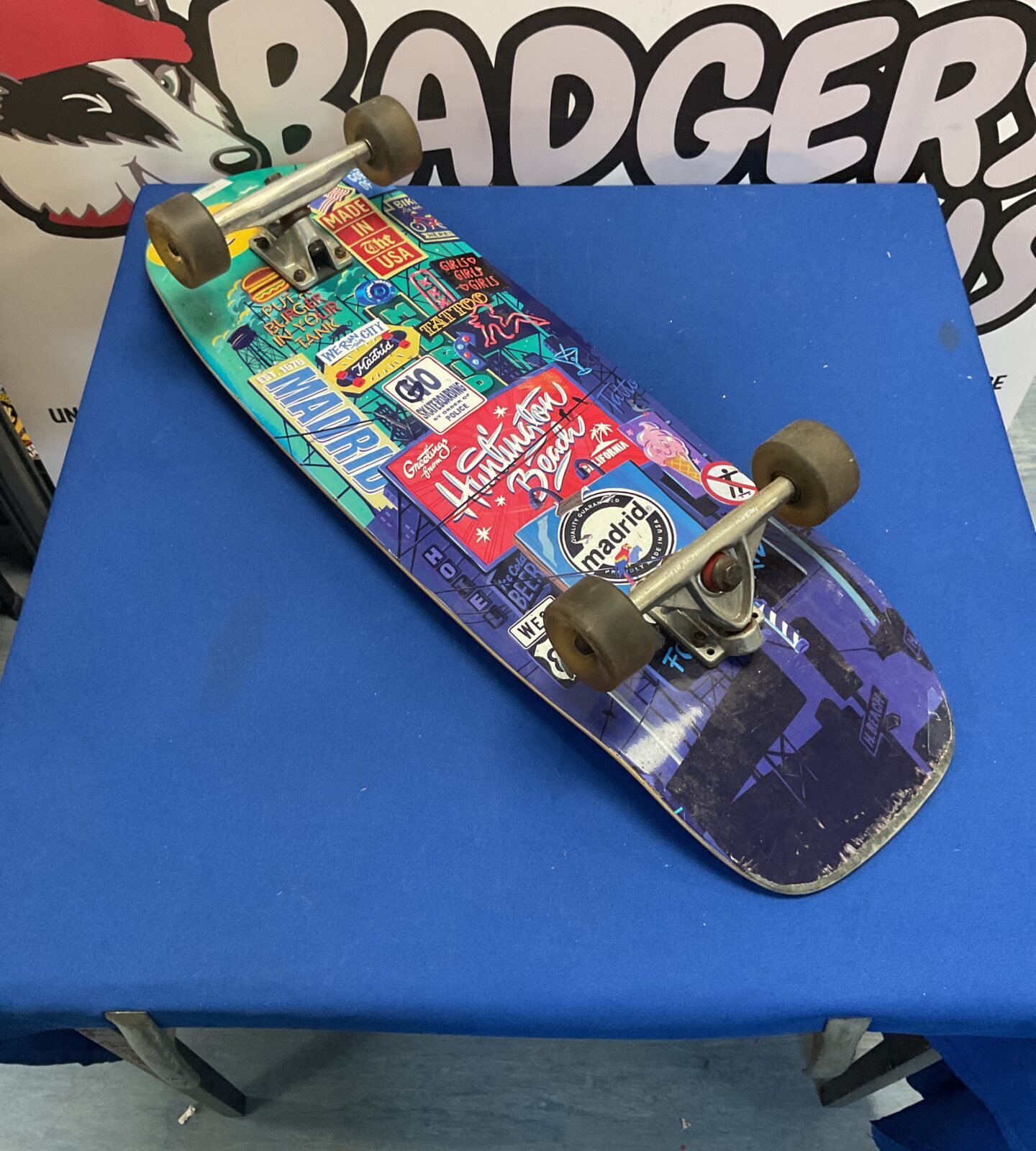 Retro bottle cruiser skateboard with checkered griptape