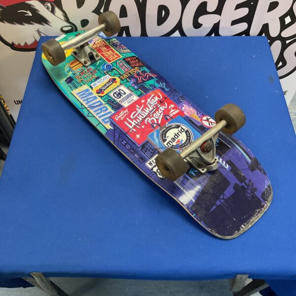 Retro bottle cruiser skateboard with checkered griptape