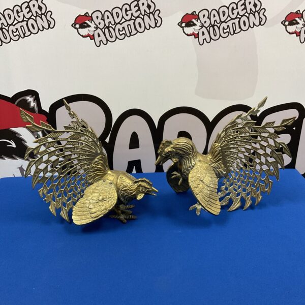 Detailed pair of vintage brass fighting cocks sculpture.