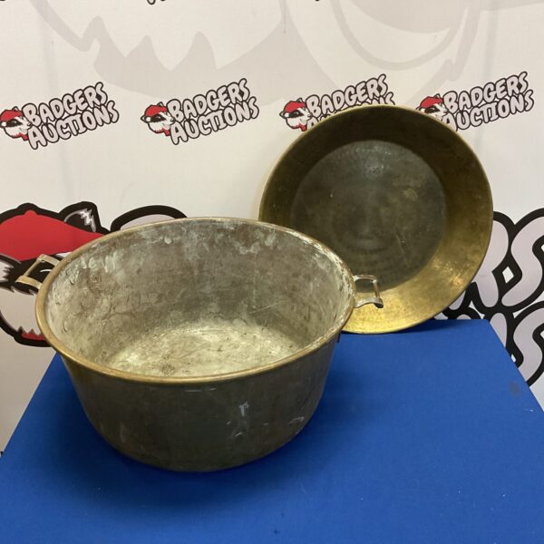 Large vintage brass bowl with handles and hammered texture.