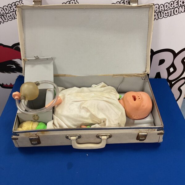 Vintage 1950s resuscitation doll with stethoscope, ideal for collectors.