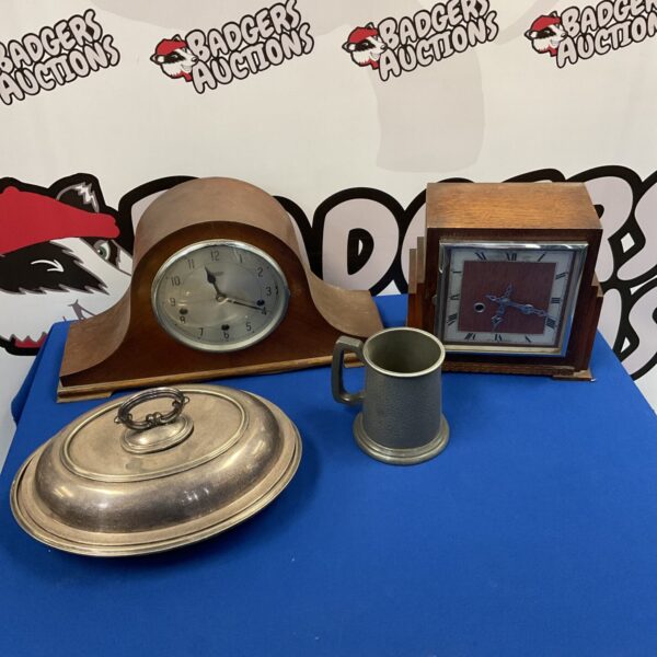 Vintage mantle clock collection with silver plate tureen and pewter tankard.