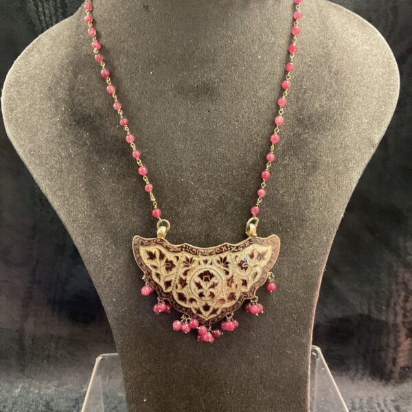 Intricate gilt enamelled ruby necklace with ruby beaded chain.