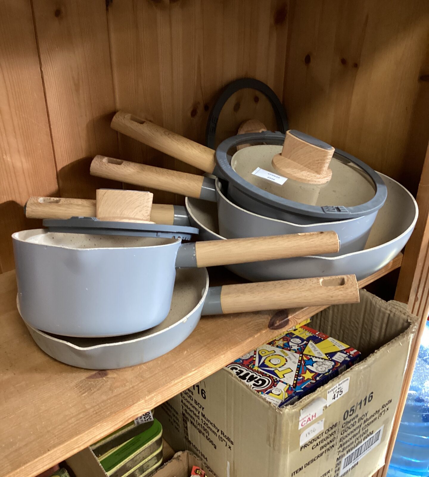 Collection of enamel cooking pans with bamboo handles