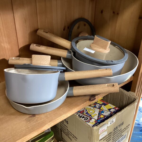 Collection of enamel cooking pans with bamboo handles