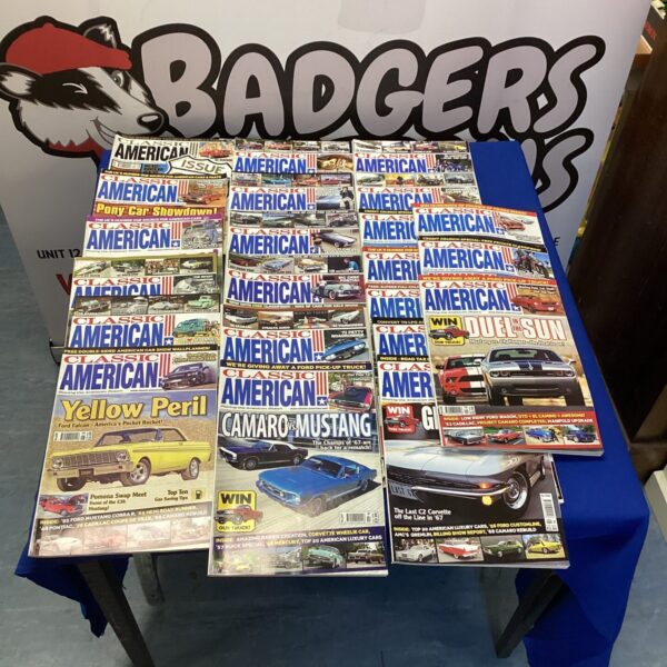 Lot of classic American car magazines, vintage automotive literature.