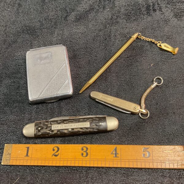 Vintage pocket knife set with silver card case and miniature pencil.