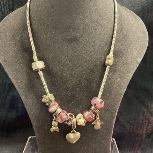 Colourful Murano glass bead necklace with angel and heart charms.