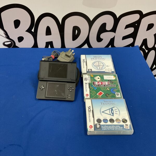 Nintendo DS console with three games and charger