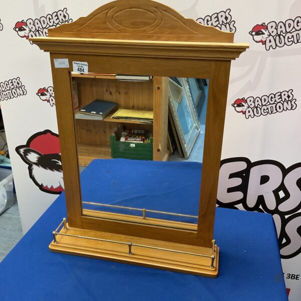 Front view of a rectangular wooden framed mirror for home decor.