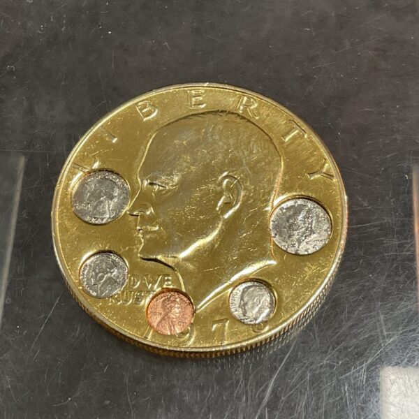 Front view of 1976 Eisenhower Dollar with proof set inlay.