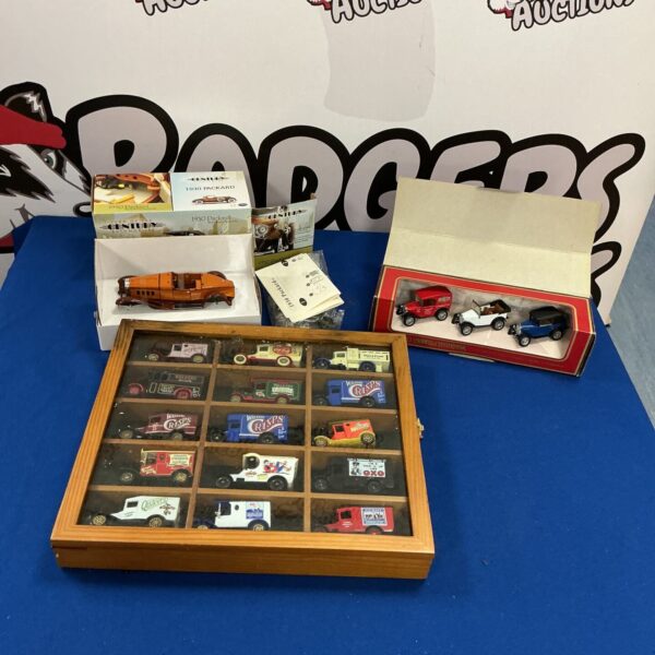 Display case featuring a diverse Matchbox and Yesteryear car collection.