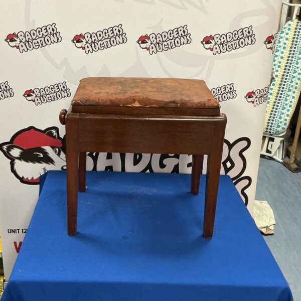 Vintage leather topped piano stool with wooden base.