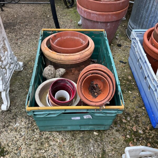 Mixed lot of terracotta and glazed garden pots for plants.