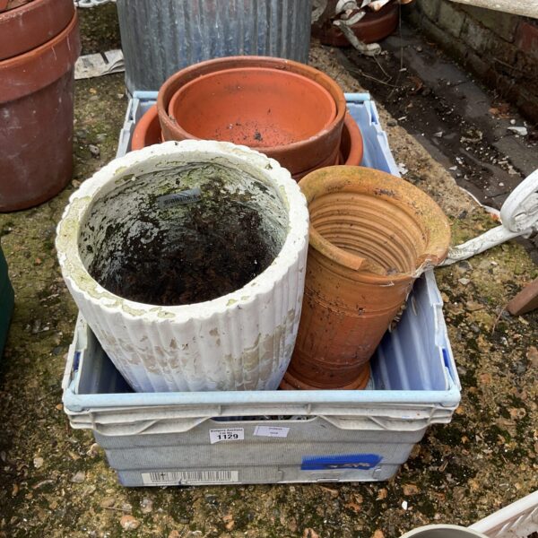 Mixed lot of terracotta and glazed garden pots for plants.