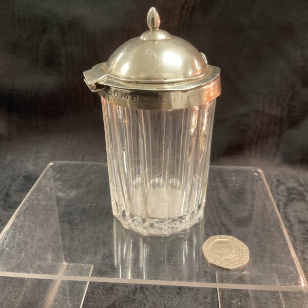 Antique Georgian silver-topped mustard jar with fluted glass.