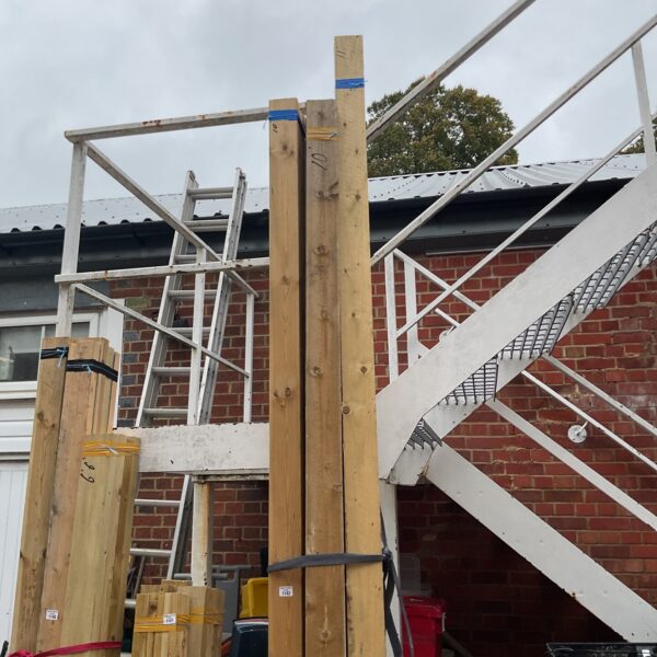 Three bundles of 10ft timber ready for construction projects.